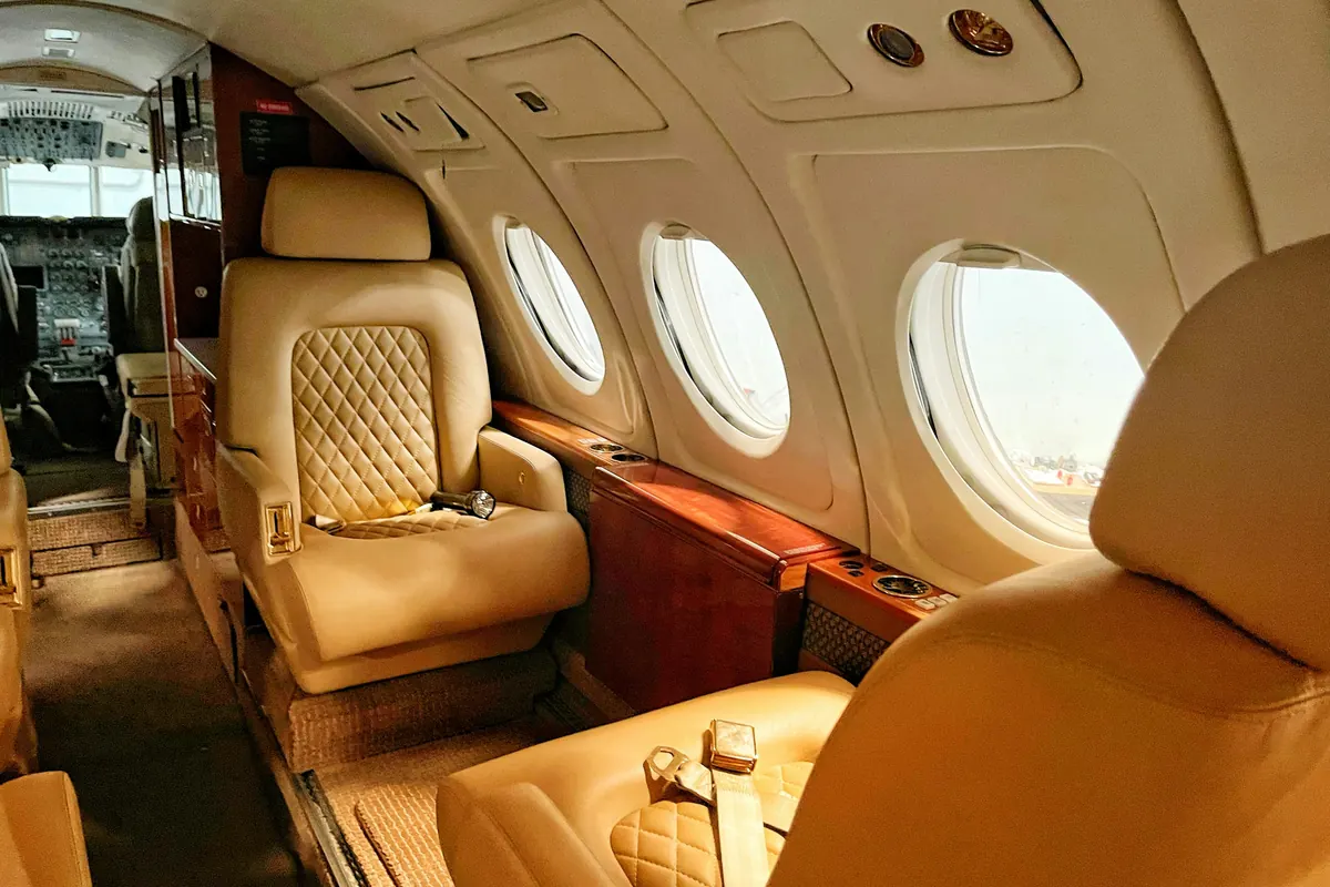 Quilted tan leather seats in a compact aircraft cabin